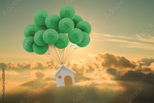 Quadro em tela Home model hanging green balloon with dollar symbol soar on photo blur landscapes on sunlight background, Saving money for buy a new house or loan for plan business investment of real estate concept