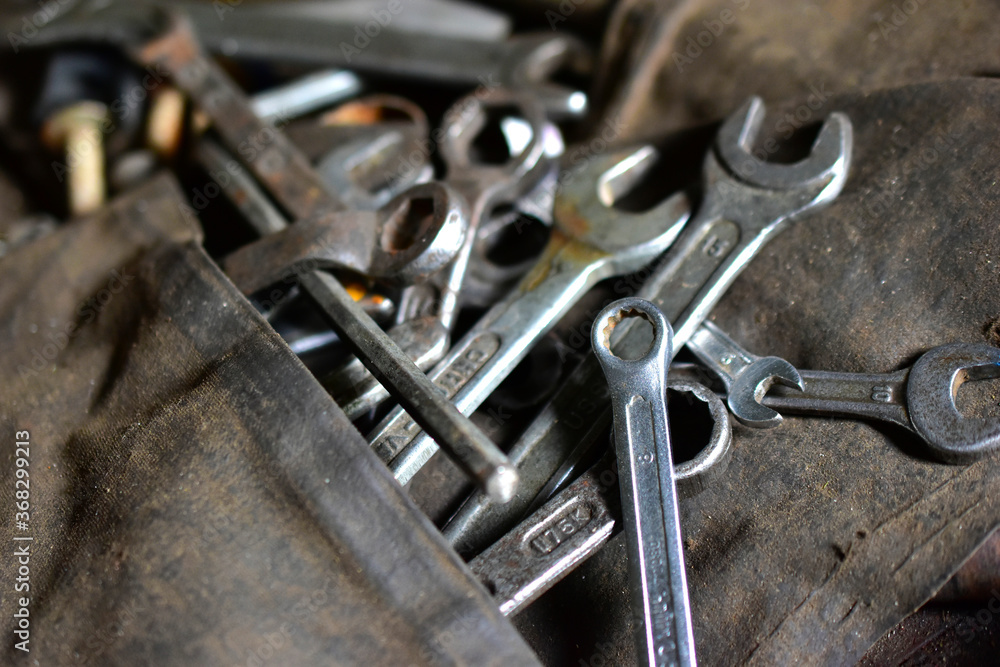 Rusty iron carob keys on a table in the garage Rusty iron carob keys on a table in the garage