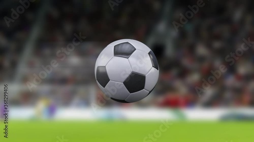 Football game. 4k football or soccer ball flying through the air in slow motion