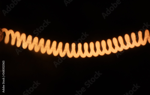 Closeup of wire from a lighted light bulb