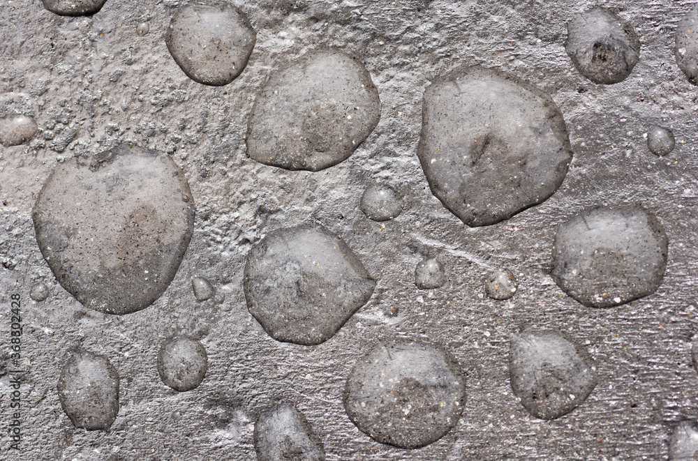 Rain drops on concrete surface Rain drops on concrete surface