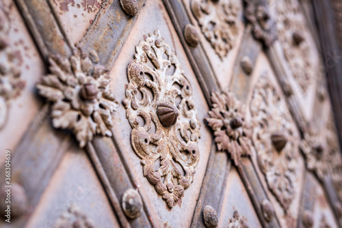 Ornate exterior door decorations in Prague, Czech Republic.