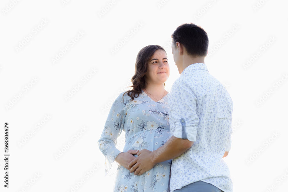 Profiles of romantic couple looking at each other on background of sunset. High quality photo Profiles of romantic couple looking at each other on background of sunset. High quality photo
