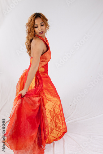 Lovely Hispanic woman in an orange dress