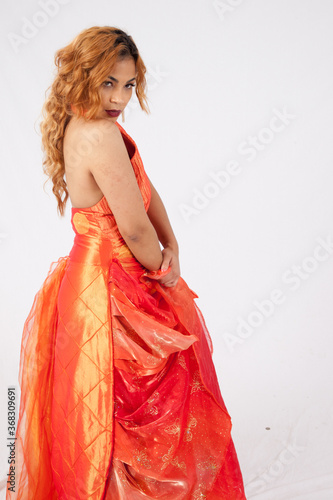 Lovely Hispanic woman in an orange dress