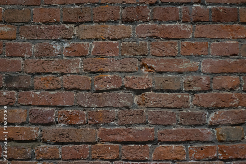 Obraz premium brick red wall. background of a old brick house.