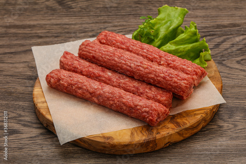 Raw beef sausages with spices