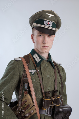 Male actor reenactor in historical uniform as an officer of the German Army during World War II photo