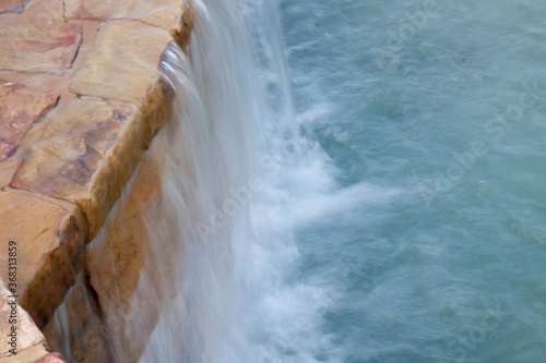 Man Made Waterfall with rock wall