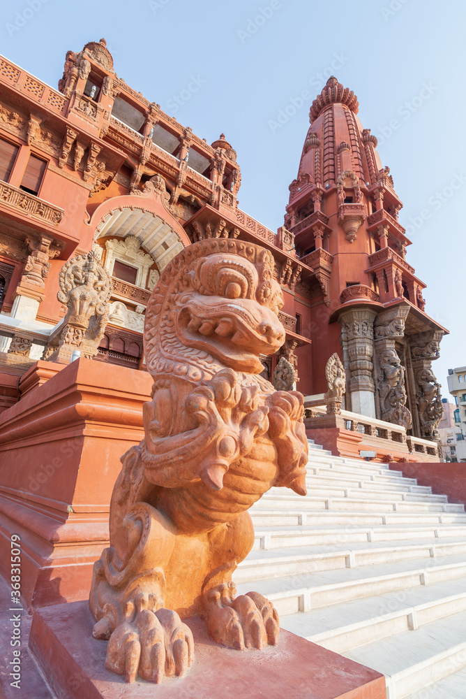 Dragon statue, an Indonesian sculpture, in front of Baron Empain Palace, a historic mansion inspired by the Cambodian Hindu temple of Angkor Wat, located in Heliopolis district, Cairo, Egypt