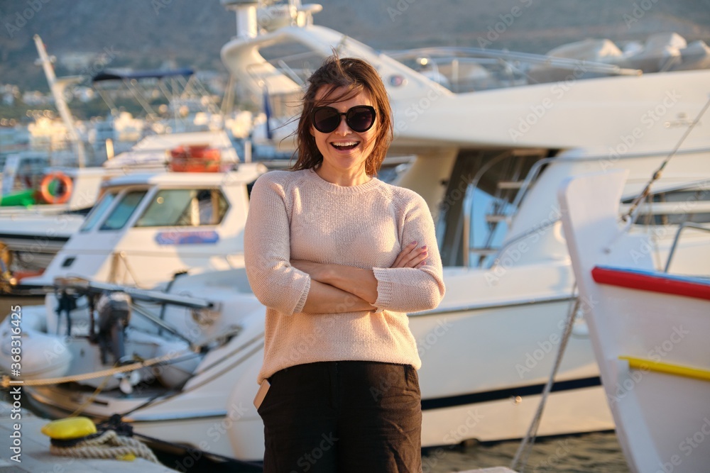 Portrait of beautiful mature successful woman, happy confident female with crossed arms Portrait of beautiful mature successful woman, happy confident female with crossed arms