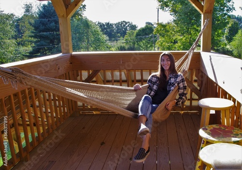young woman relaxing in a hammock