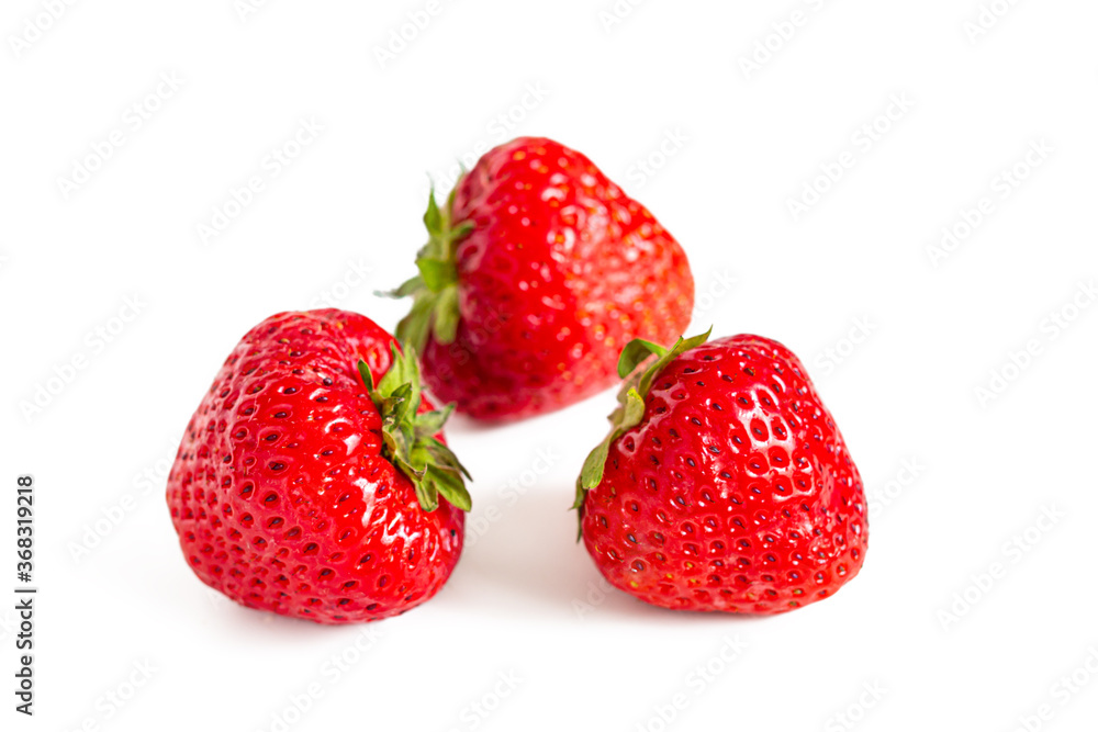 Red ripe strawberries with green sepals Red ripe strawberries with green sepals