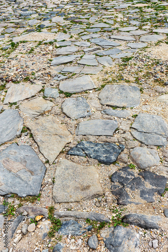 Urban stone paving, perspective. Texture, background, selective focus