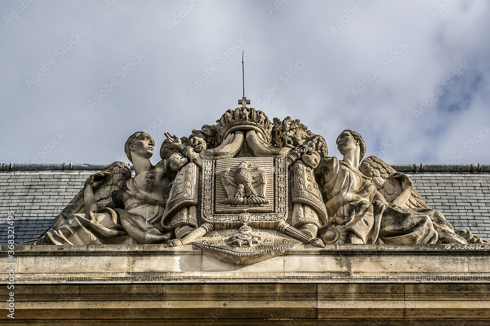 Architectural fragments of old building of Military School (Ecole Militaire, founded by Louis XV in 1750). Champ de Mars, Paris, France.