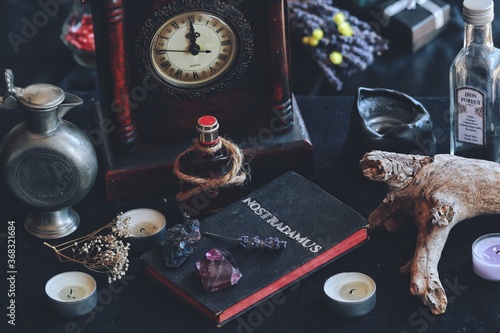 Small diy hand made book on a wiccan witch altar that has a word 