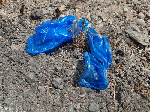 blue plastic gloves virus pollution