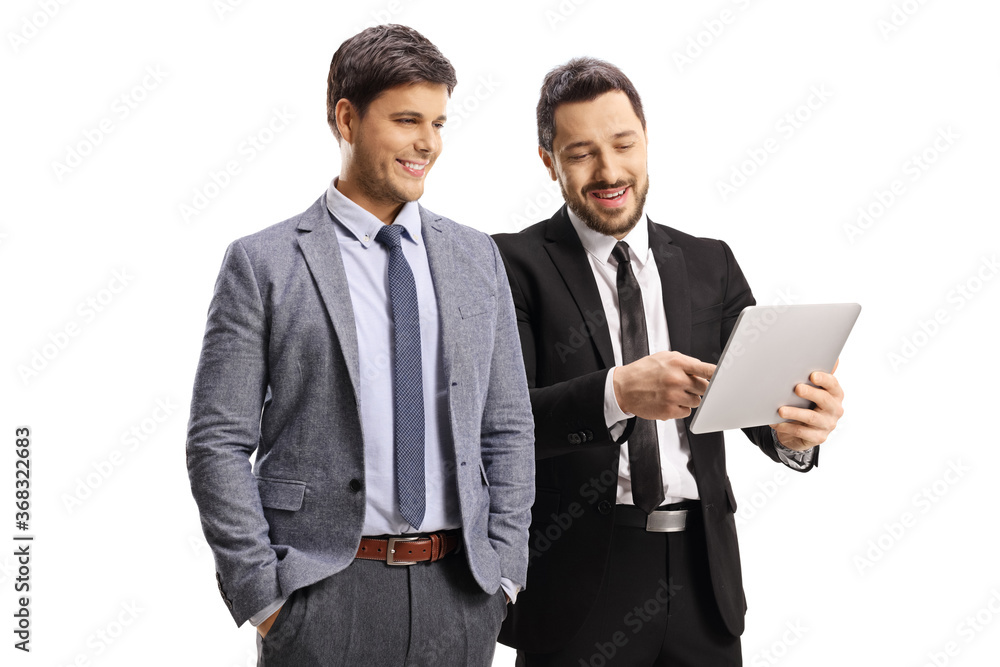 Two pofessional men looking at a digital tablet device Two pofessional men looking at a digital tablet device