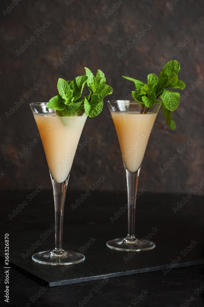 Cocktail in glasses with mint leaves, selective focus Cocktail in glasses with mint leaves, selective focus
