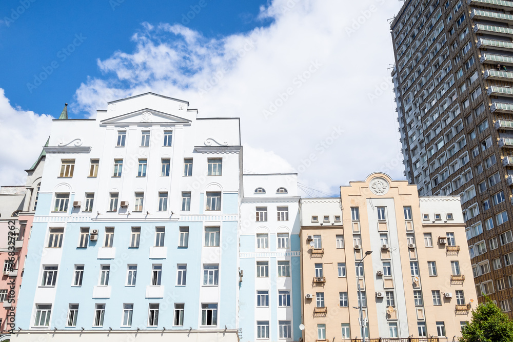 colored facades of apartment houses on New Arbat Avenue in Moscow city on sunny summer day
