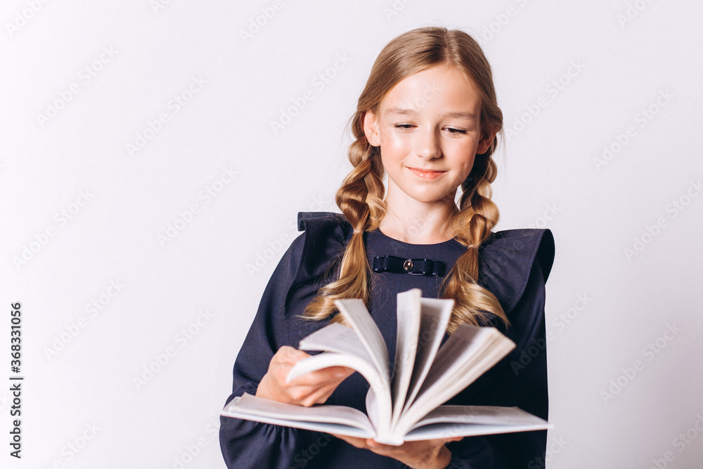 Back to school. Cute adorable caucasian blondie girl with glode in school uniform on white background Back to school. Cute adorable caucasian blondie girl with glode in school uniform on white background