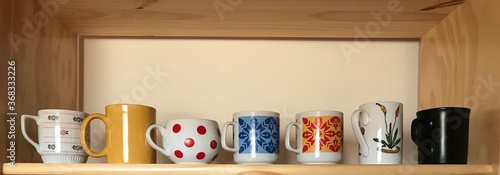 Collection of Mugs on a Shelf
