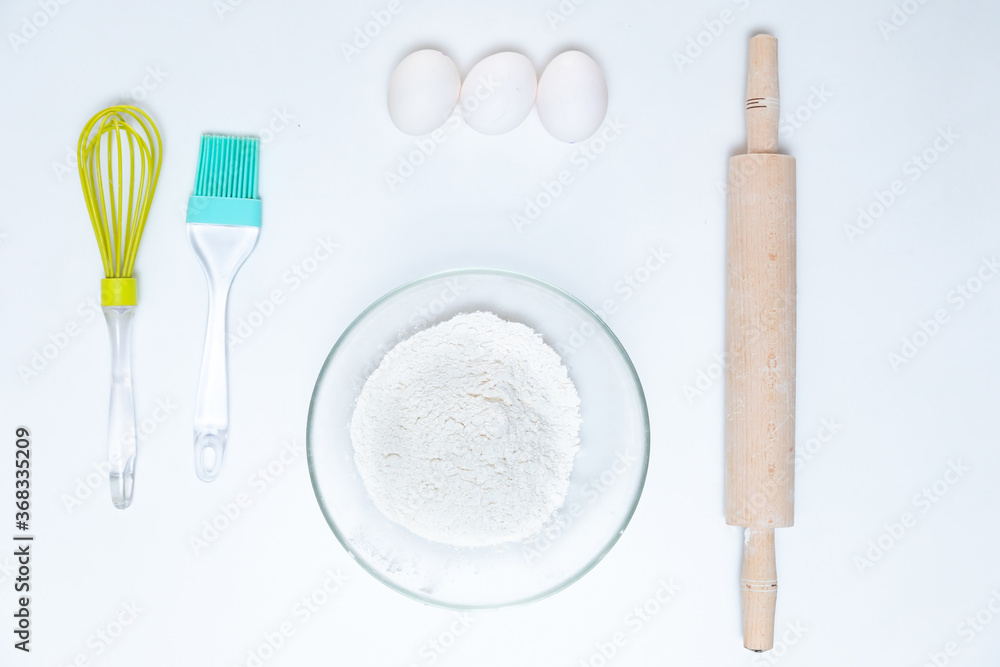 Eggs, flour, rolling pin, shape, corolla, baking ingredients. Eggs, flour, rolling pin, shape, corolla, baking ingredients.