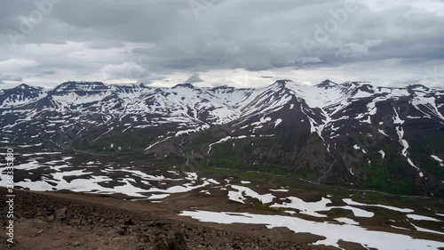 4K high quality timelapse footage from the top of Sulur Mountain near Akureyri in northern Iceland. Cloudy summer day behind the Icelandic arctic circle. Incredible landscape. Tourism Iceland. photo