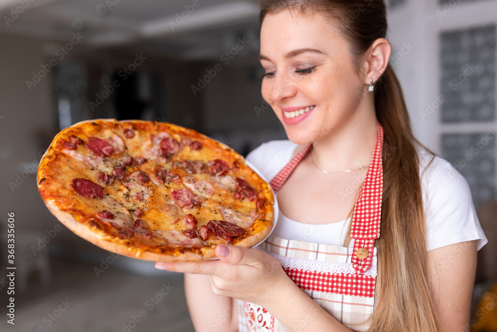 Happy Young Woman Cooking Pizza at Home. Happy Young Woman Cooking Pizza at Home.