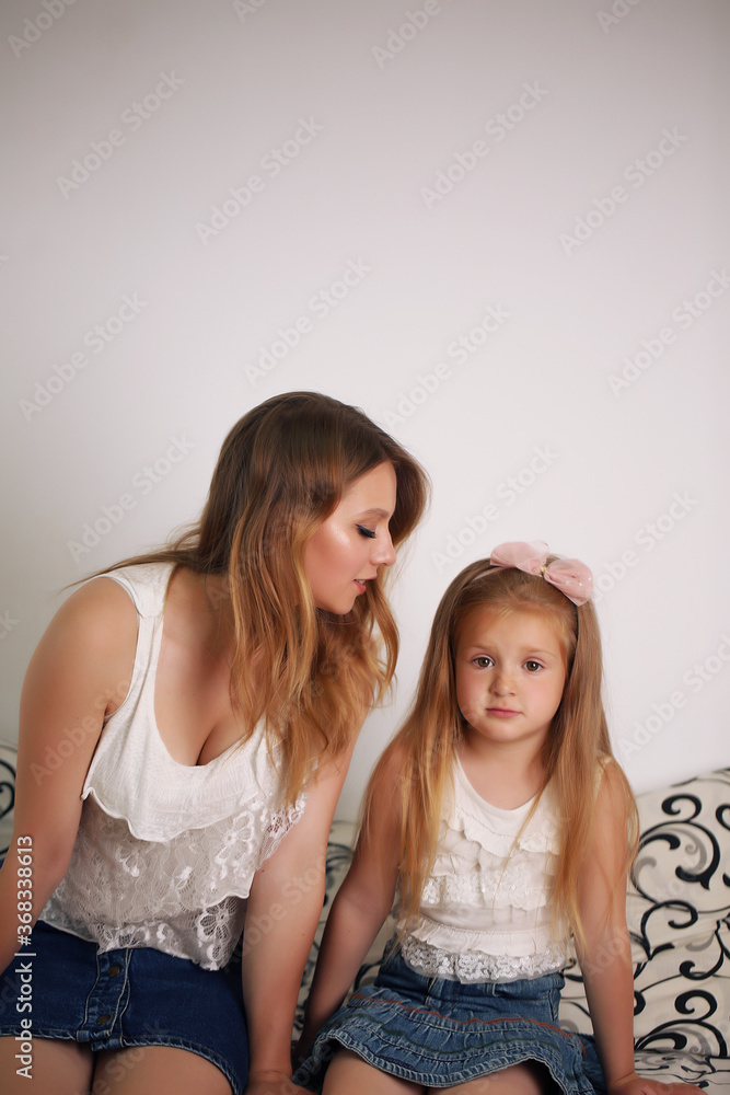 Happy loving family. Mother and her girl play, kiss and hug. Happy loving family. Mother and her girl play, kiss and hug.