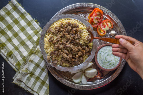 An Anatolian culture dish, bulgur pilaf and bean dish at the table