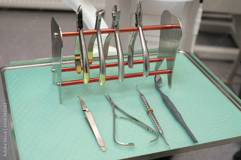 Orthodontic tools for braces on dental office background