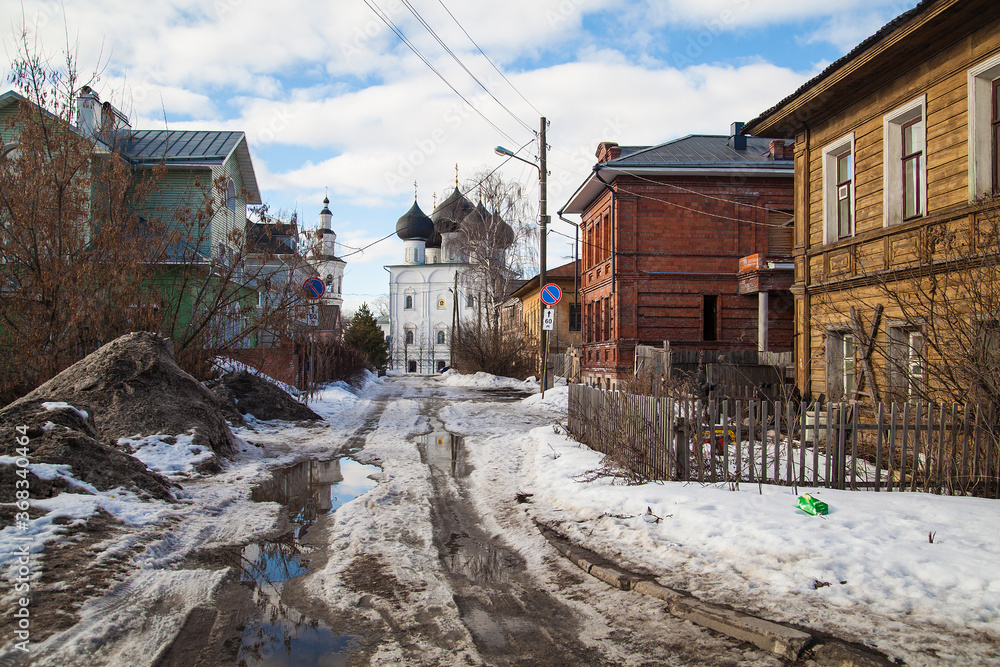 Dirty spring road to church un small russian villiage