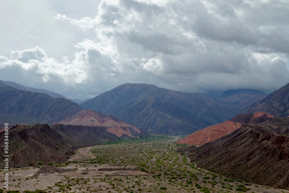 Desert landscape. Aerial view of  the beautiful valley and mountains under a dramatic cloudy sky. 