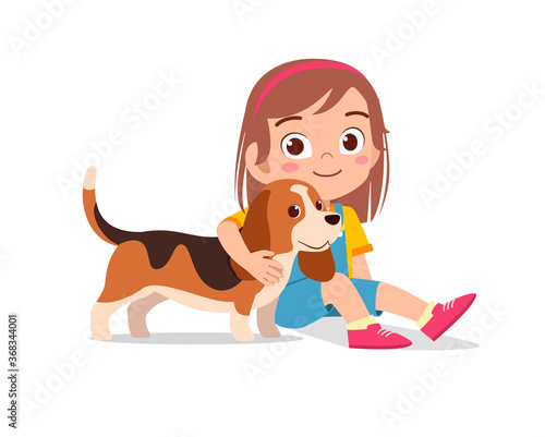 happy cute little kid boy girl play with pet dog