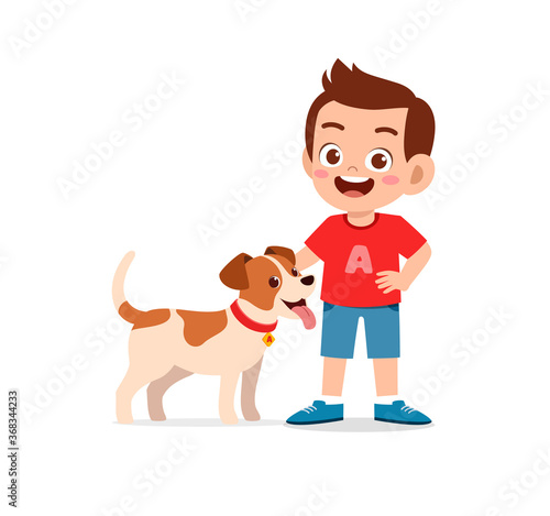 happy cute little kid boy girl play with pet dog