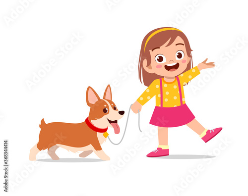 happy cute little kid boy girl play with pet dog