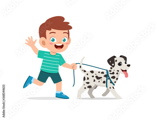 happy cute little kid boy girl play with pet dog