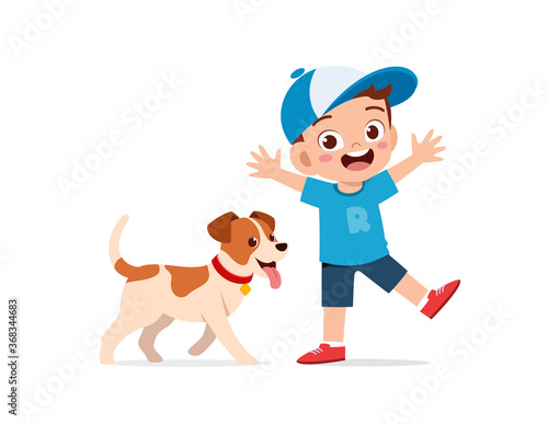 happy cute little kid boy girl play with pet dog