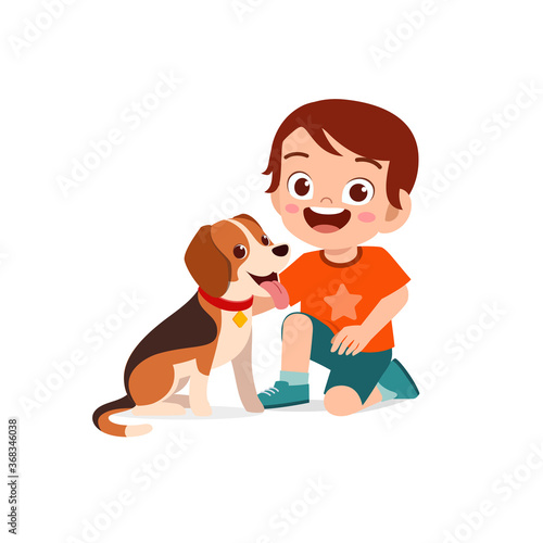 happy cute little kid boy girl play with pet dog