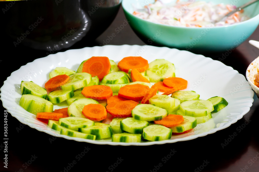 Healthy Veggies. Cucumbers and Carrot sliced. Healthy Veggies. Cucumbers and Carrot sliced.