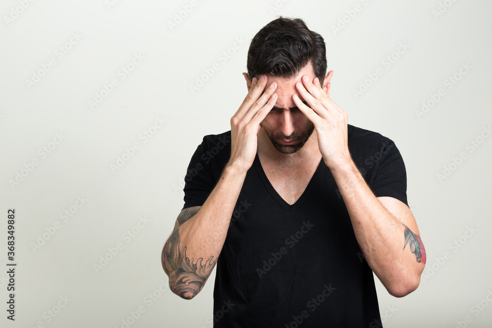 Portrait of handsome bearded man as rebel