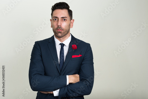 Portrait of handsome bearded businessman in suit