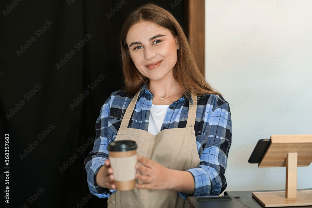 Female barista in modern cafe Female barista in modern cafe