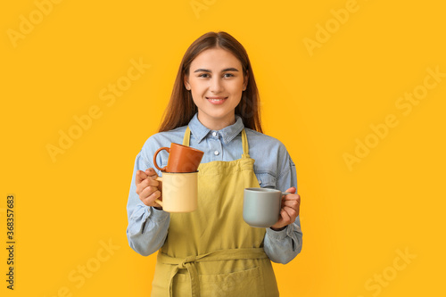 Female barista on color bac...