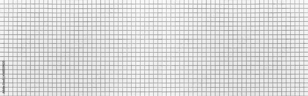 Panorama of White mosaic wall tile pattern and seamless background Panorama of White mosaic wall tile pattern and seamless background