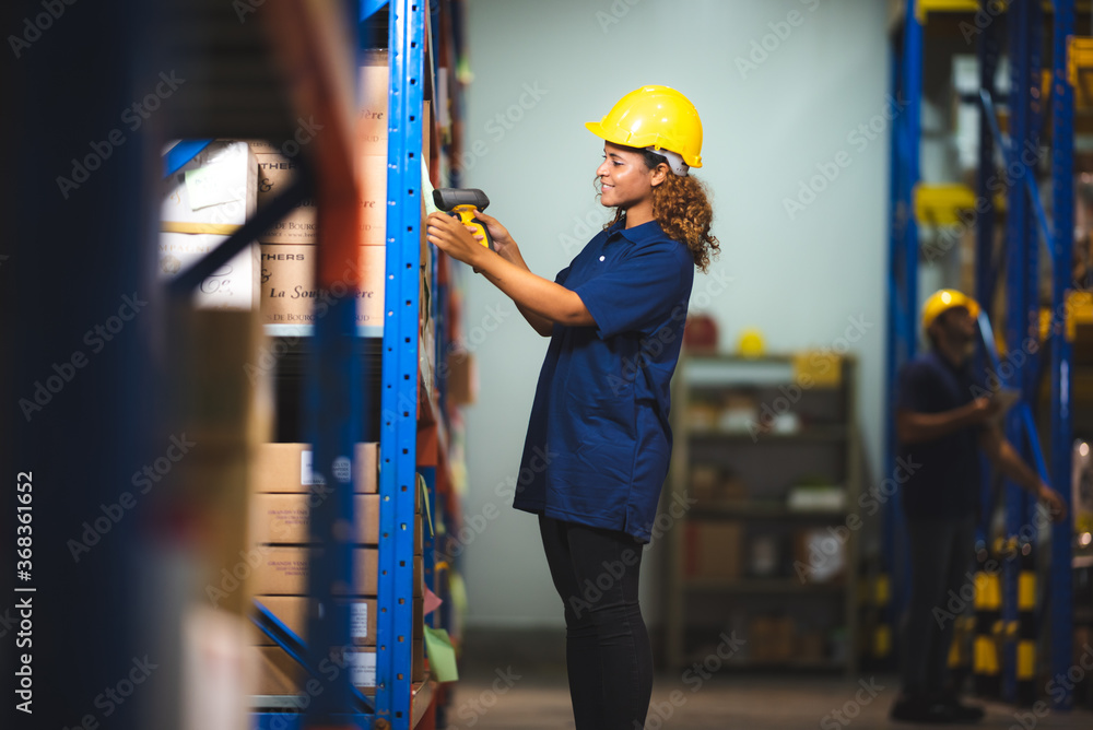 The warehouse manager checking the store supply and package in the freight industrial factory The warehouse manager checking the store supply and package in the freight industrial factory
