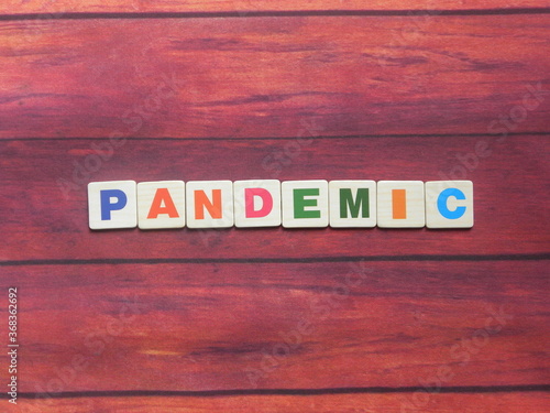 Word Pandemic on wood background