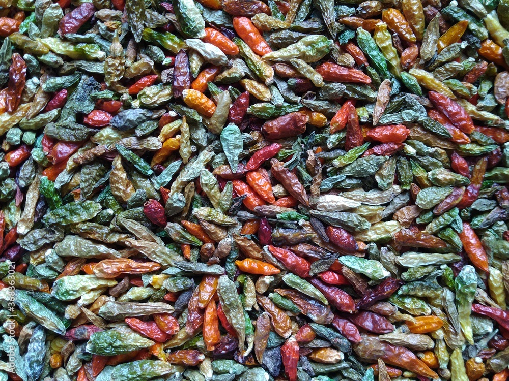 Heap of colorful dry raw whole Bird's eye chili