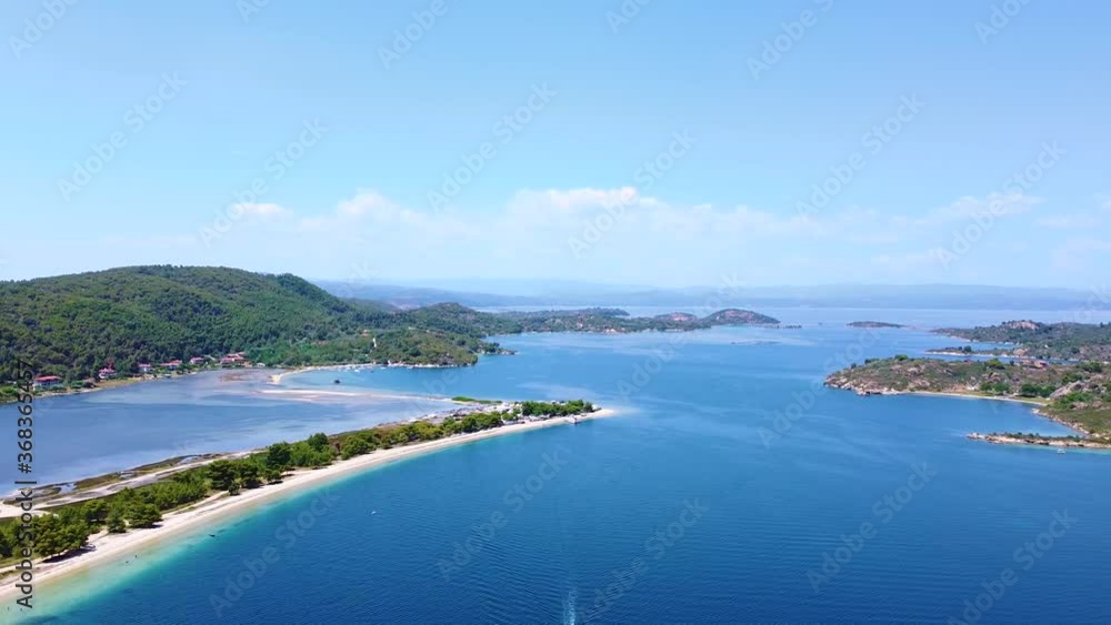 Aerial view of long sandy beach and blue lagoon with big island. Tourist resort and exotic destination for travel Aerial view of long sandy beach and blue lagoon with big island. Tourist resort and exotic destination for travel
